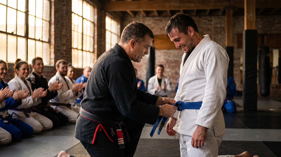 Instructor tying a new blue belt on a student at a promotion