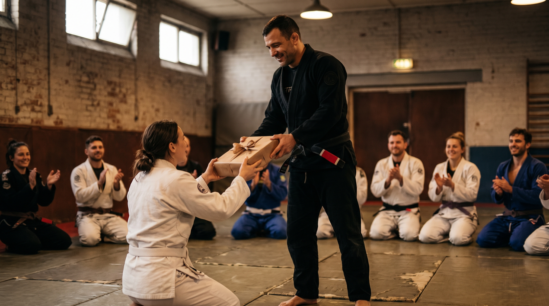 BJJ black belt coach receiving a gift from a student