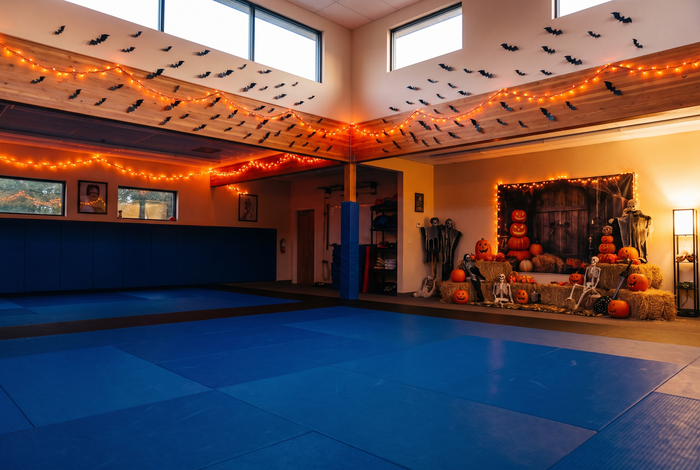 BJJ gym decorated for a Halloween open mat