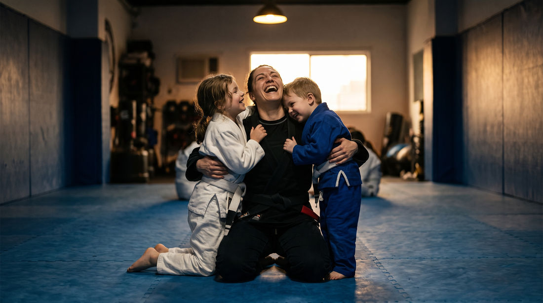 BJJ mom in a gi getting a hug from her kids on the mats