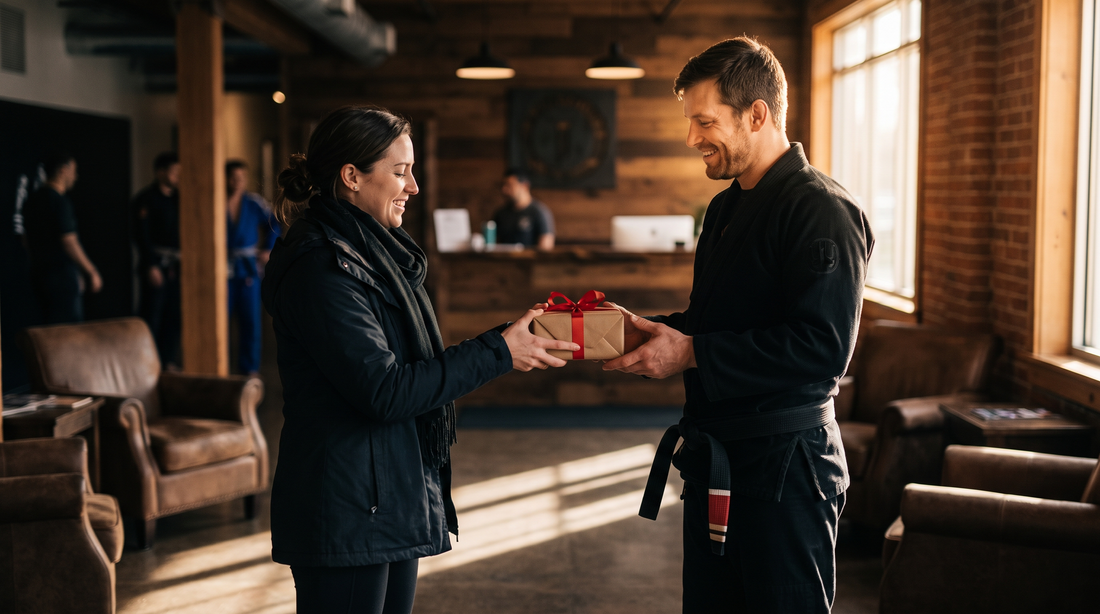 Partner giving a red-ribbon gift to a man in a BJJ gi